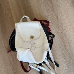One of 3 vintage coach mini backpacks